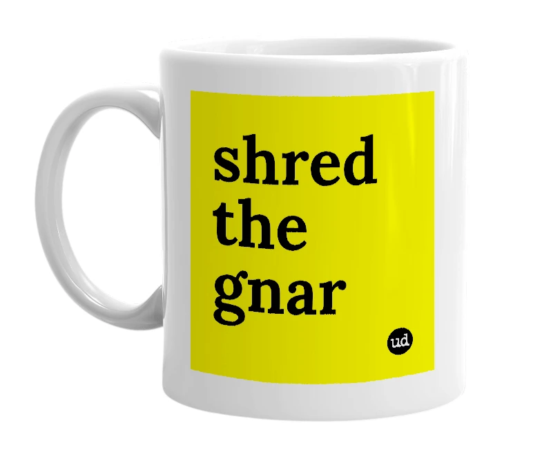 White mug with 'shred the gnar' in bold black letters