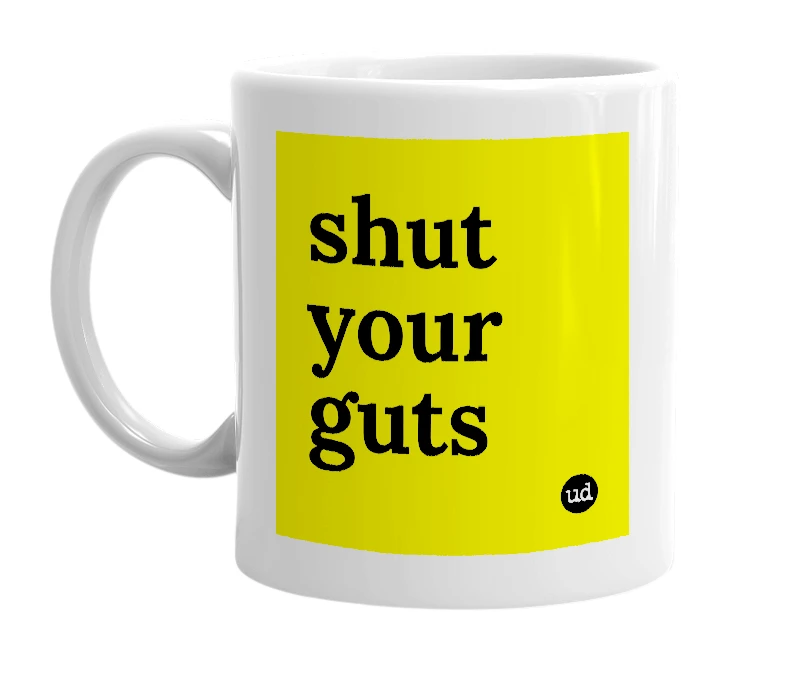 White mug with 'shut your guts' in bold black letters