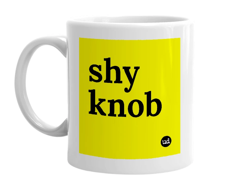 White mug with 'shy knob' in bold black letters