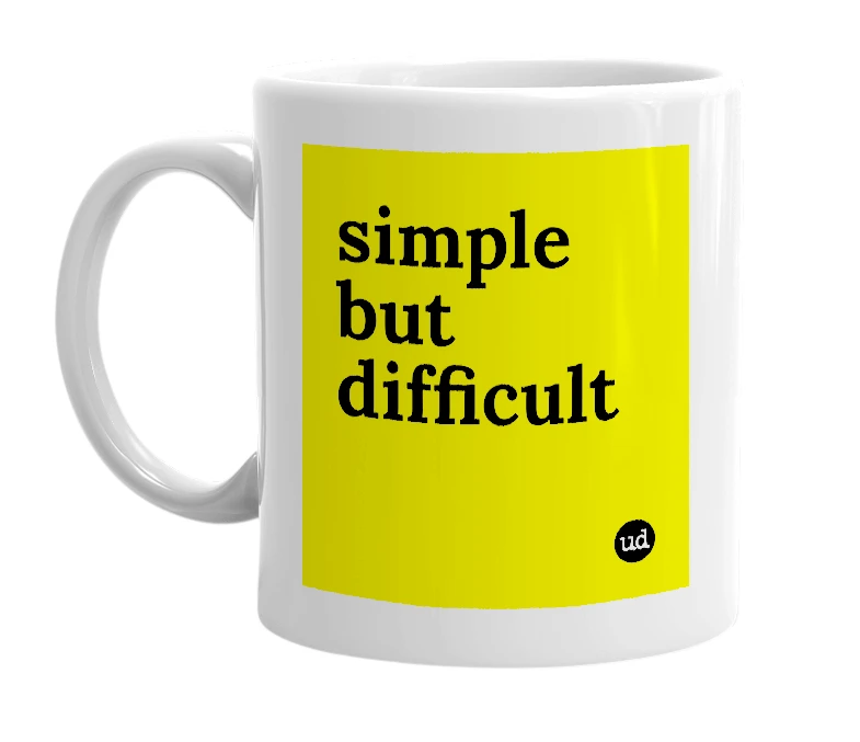 White mug with 'simple but difficult' in bold black letters
