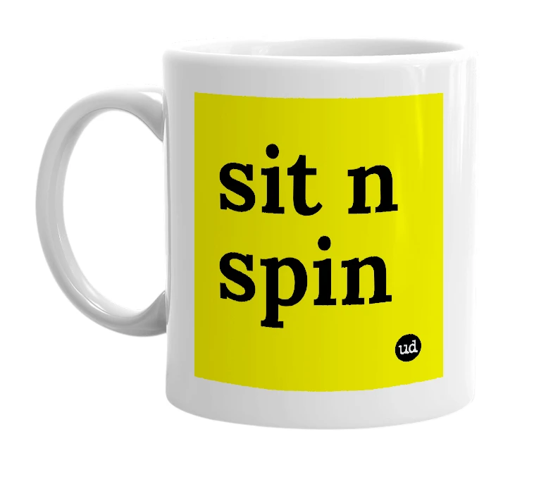 White mug with 'sit n spin' in bold black letters