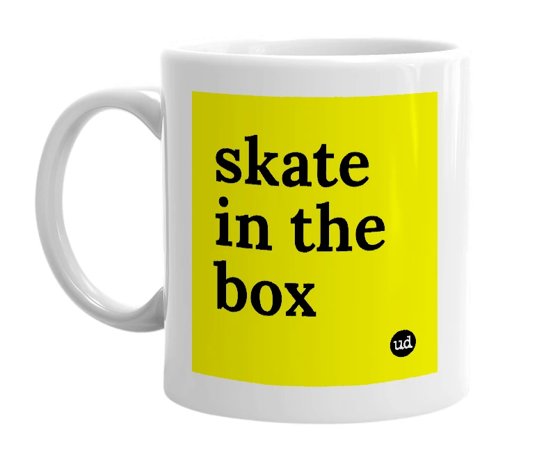 White mug with 'skate in the box' in bold black letters