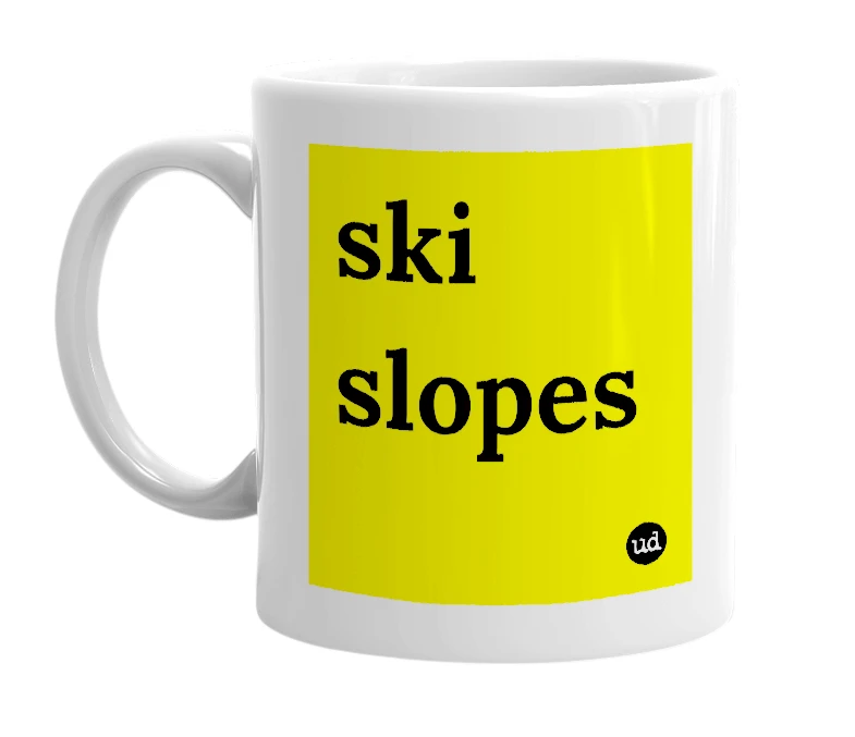 White mug with 'ski slopes' in bold black letters