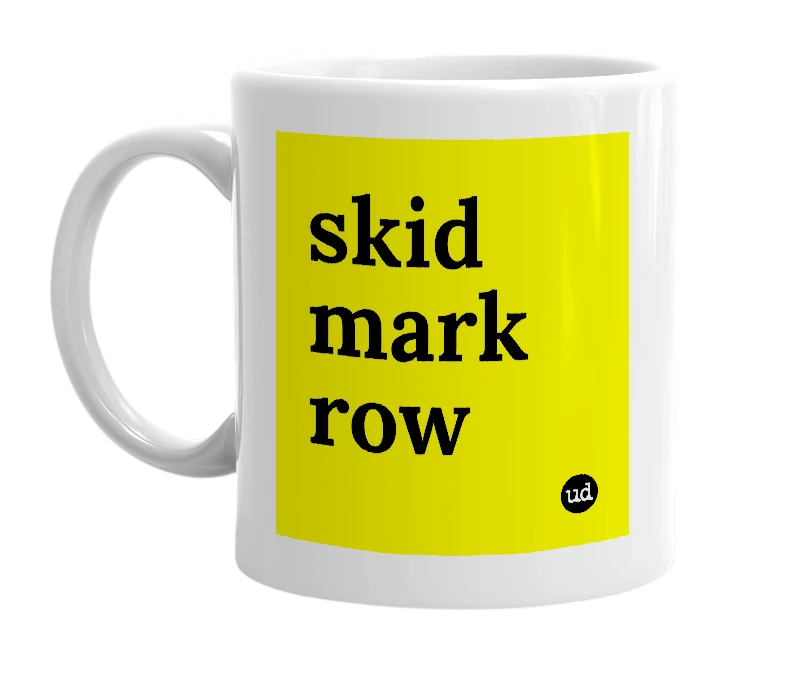 White mug with 'skid mark row' in bold black letters