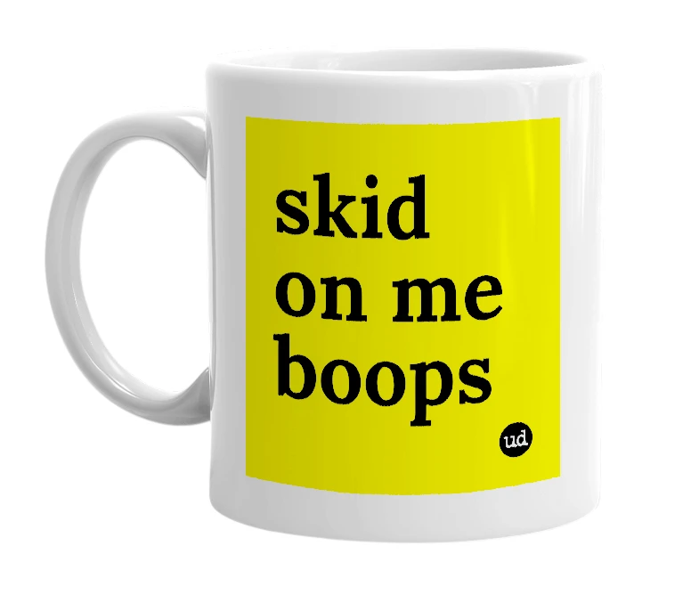 White mug with 'skid on me boops' in bold black letters