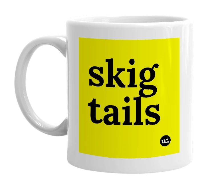 White mug with 'skig tails' in bold black letters