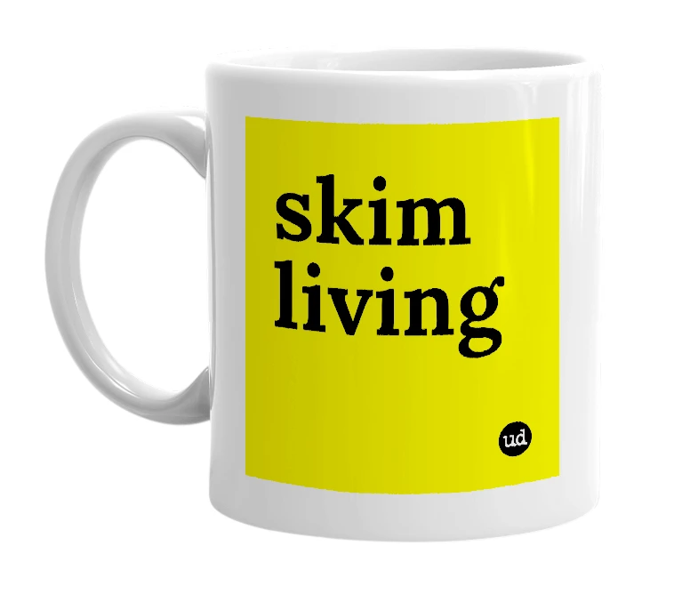 White mug with 'skim living' in bold black letters
