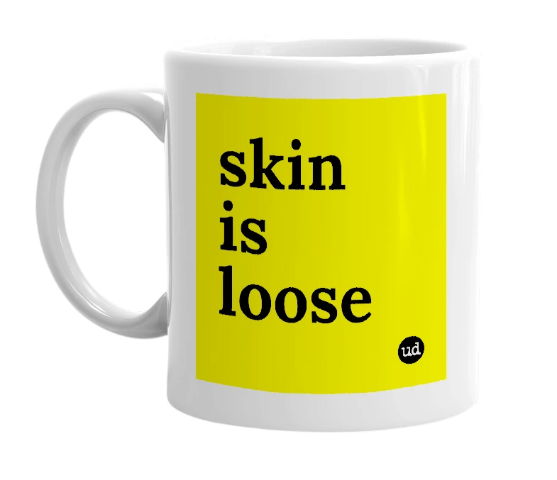 White mug with 'skin is loose' in bold black letters