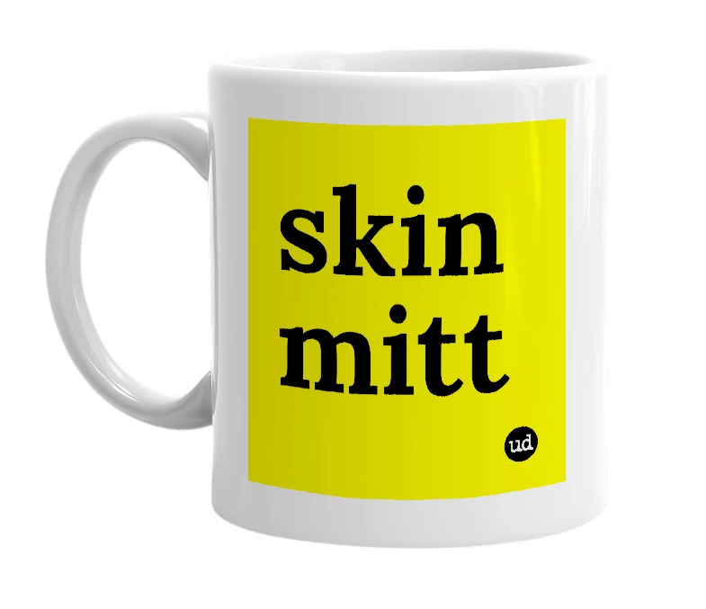 White mug with 'skin mitt' in bold black letters