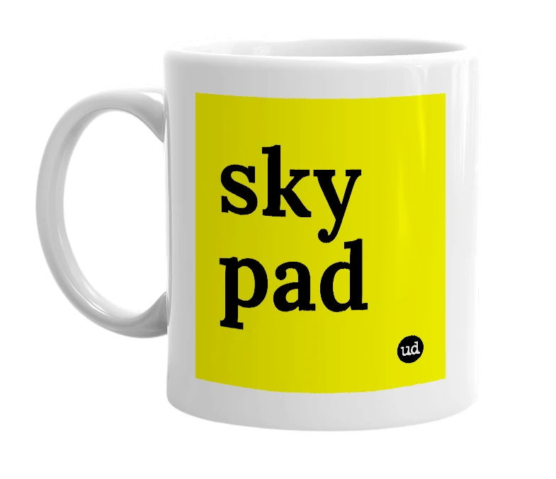 White mug with 'sky pad' in bold black letters