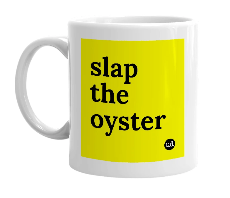 White mug with 'slap the oyster' in bold black letters
