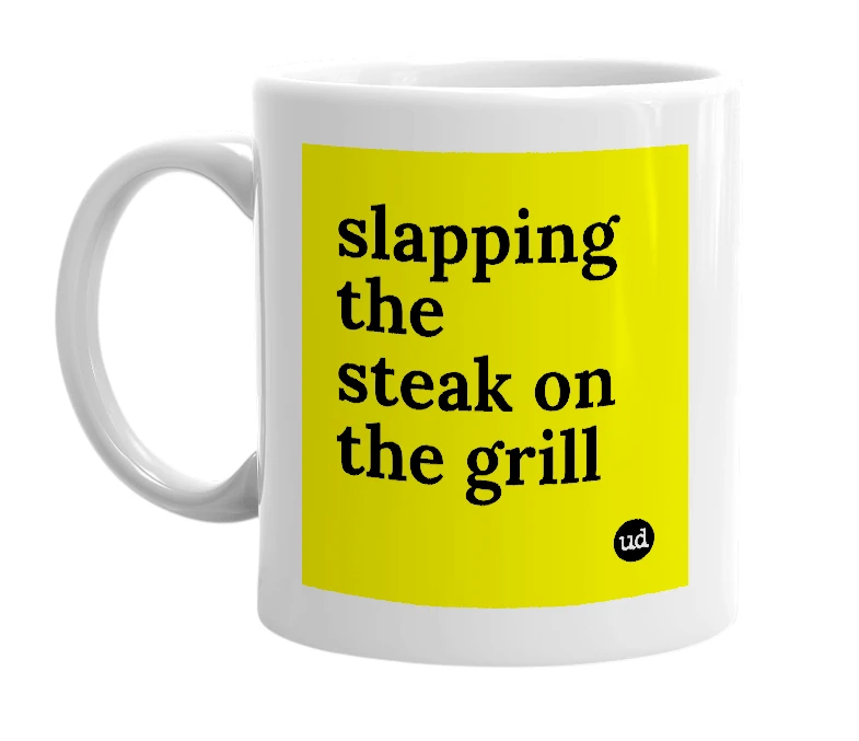 White mug with 'slapping the steak on the grill' in bold black letters