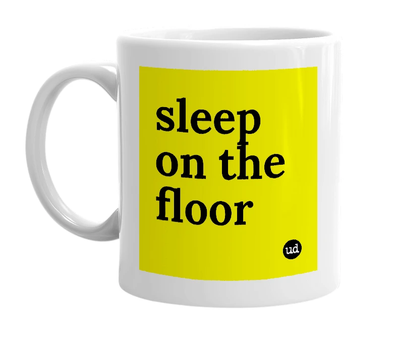 White mug with 'sleep on the floor' in bold black letters