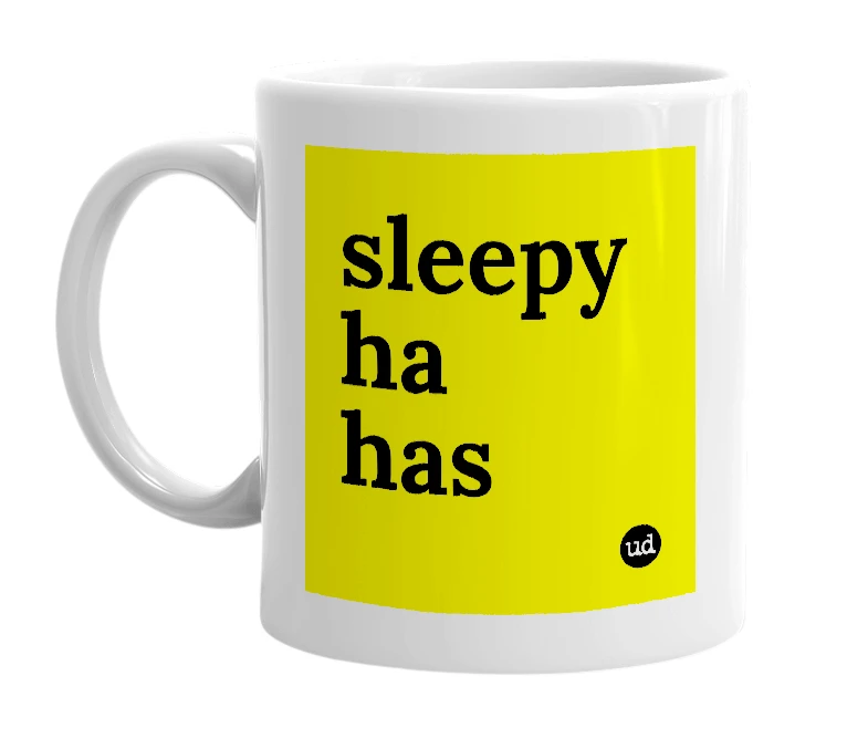 White mug with 'sleepy ha has' in bold black letters