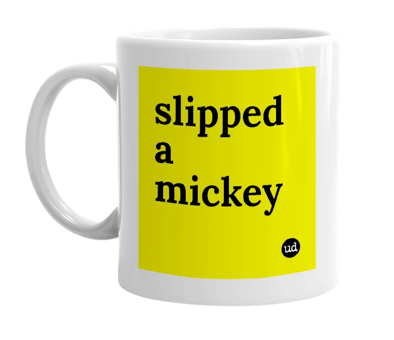 White mug with 'slipped a mickey' in bold black letters