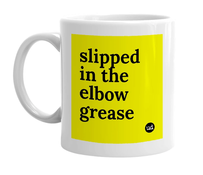 White mug with 'slipped in the elbow grease' in bold black letters