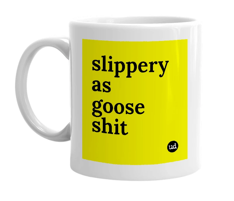 White mug with 'slippery as goose shit' in bold black letters