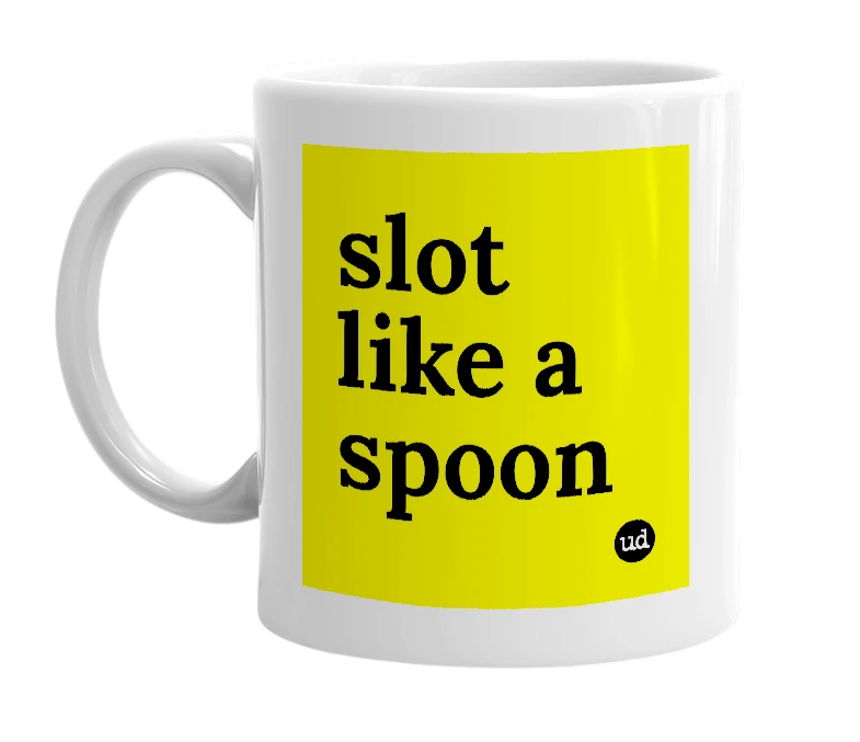 White mug with 'slot like a spoon' in bold black letters