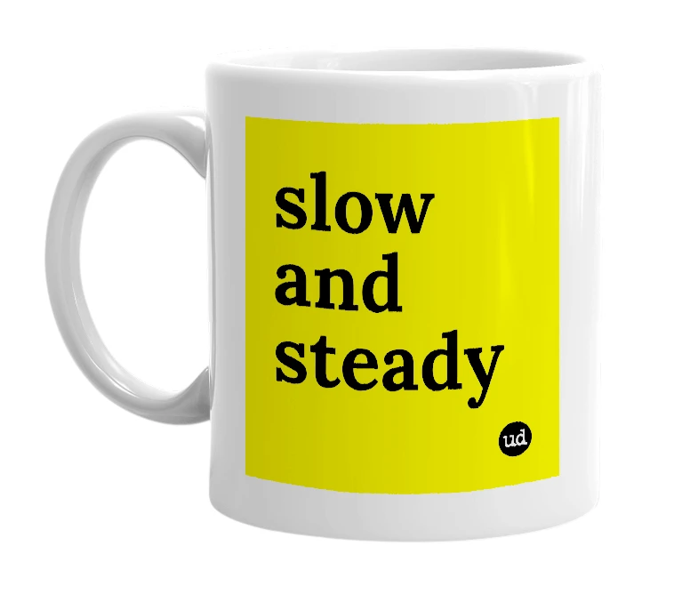 White mug with 'slow and steady' in bold black letters