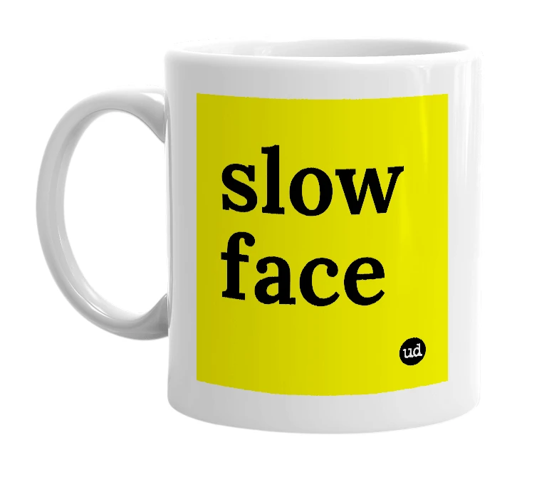 White mug with 'slow face' in bold black letters