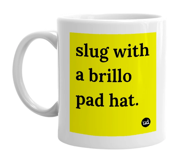 White mug with 'slug with a brillo pad hat.' in bold black letters