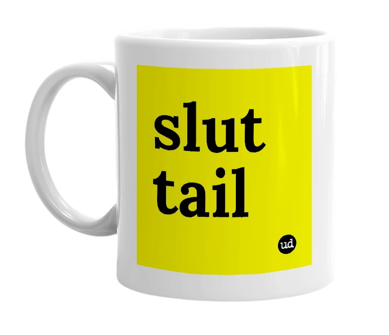 White mug with 'slut tail' in bold black letters