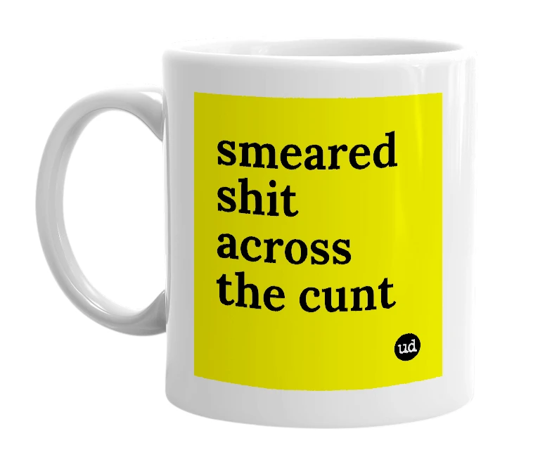 White mug with 'smeared shit across the cunt' in bold black letters