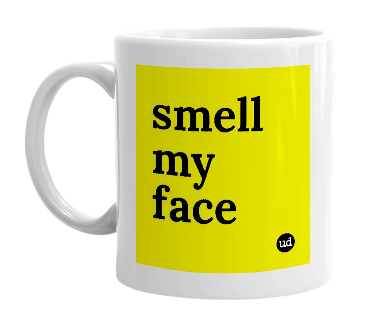 White mug with 'smell my face' in bold black letters