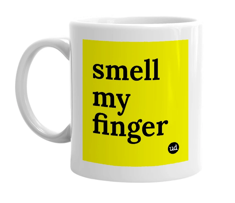 White mug with 'smell my finger' in bold black letters