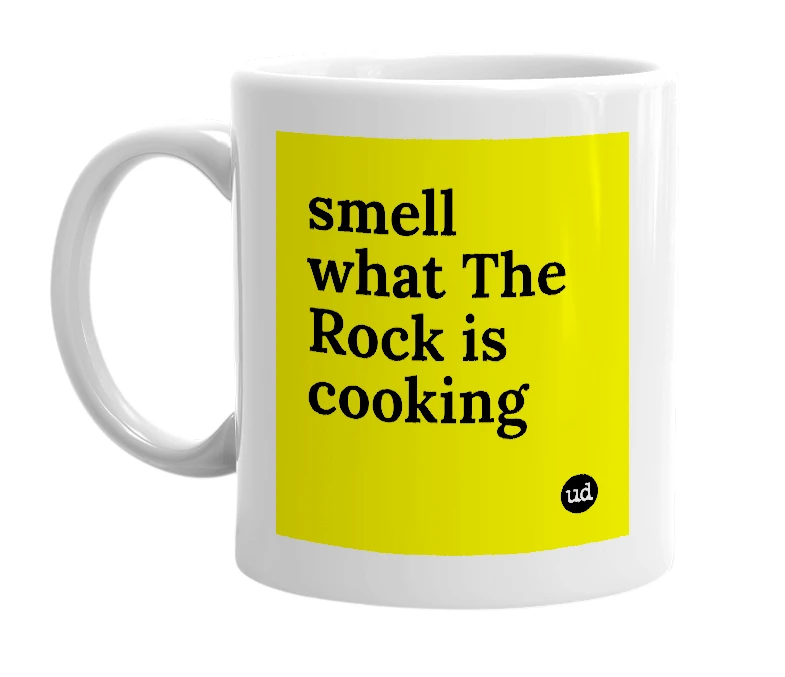 White mug with 'smell what The Rock is cooking' in bold black letters