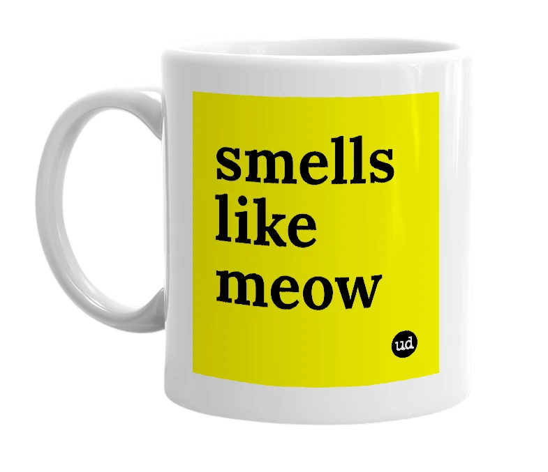 White mug with 'smells like meow' in bold black letters