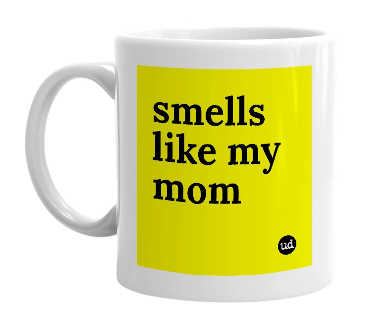 White mug with 'smells like my mom' in bold black letters