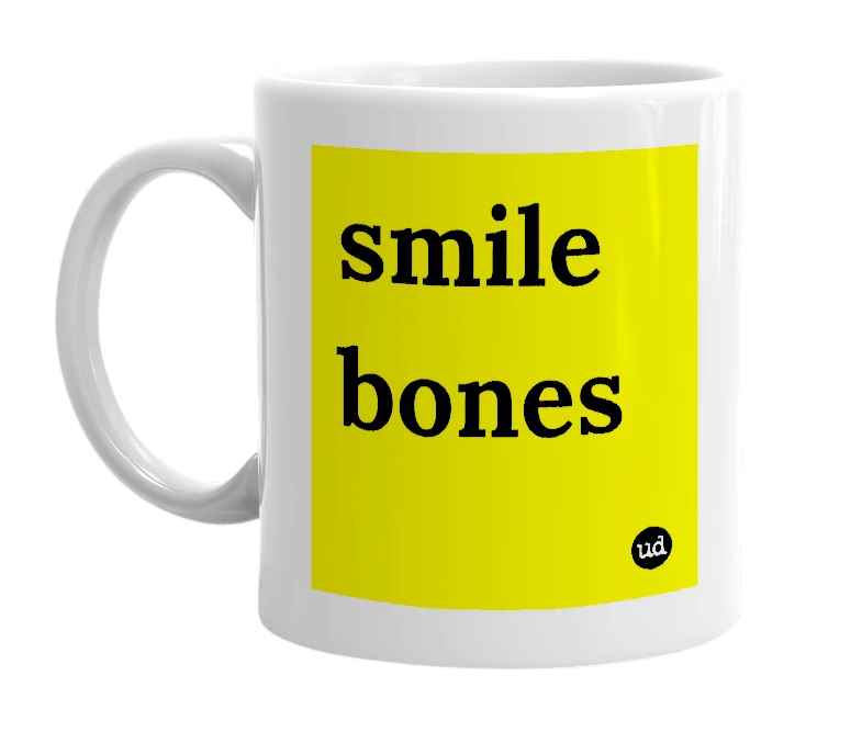 White mug with 'smile bones' in bold black letters
