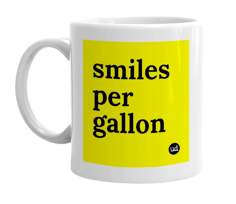 White mug with 'smiles per gallon' in bold black letters