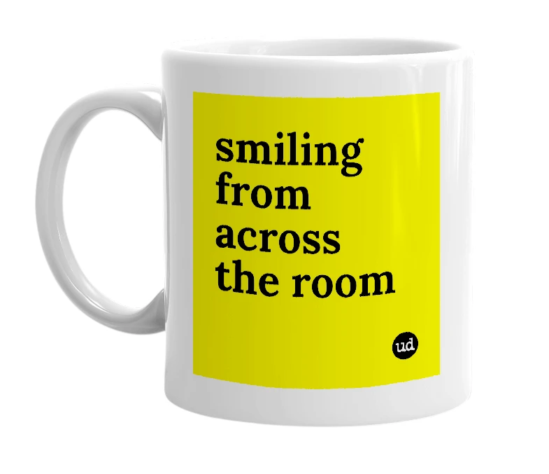 White mug with 'smiling from across the room' in bold black letters