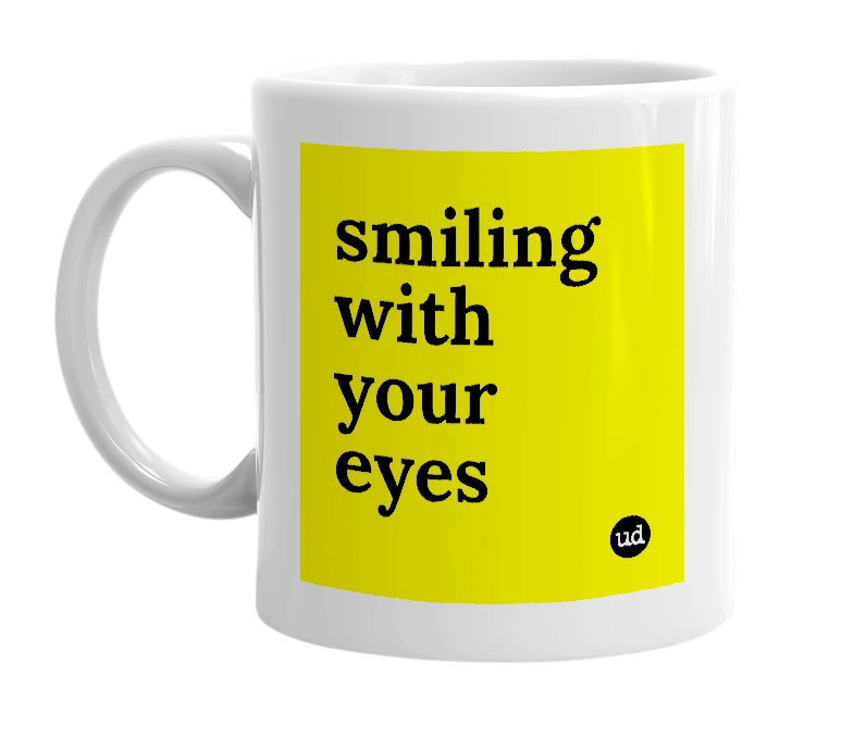 White mug with 'smiling with your eyes' in bold black letters