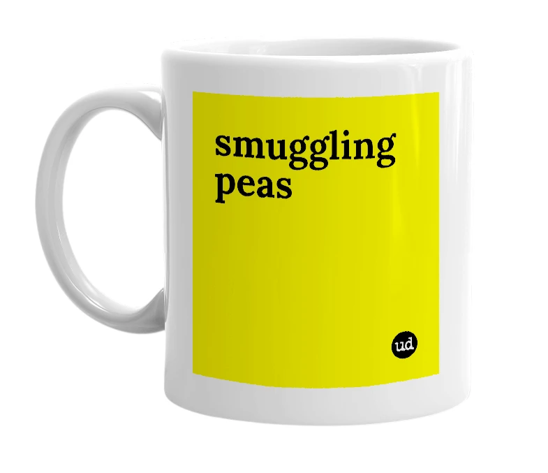 White mug with 'smuggling peas' in bold black letters