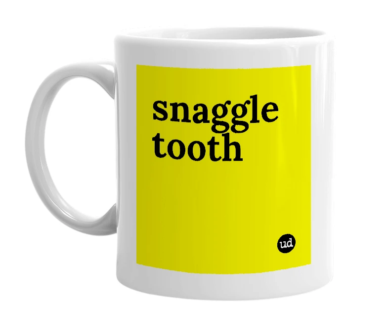 White mug with 'snaggle tooth' in bold black letters