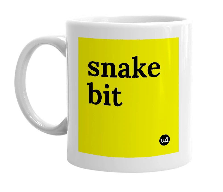 White mug with 'snake bit' in bold black letters