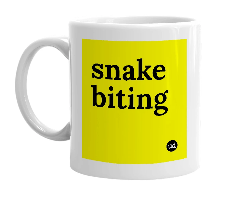 White mug with 'snake biting' in bold black letters