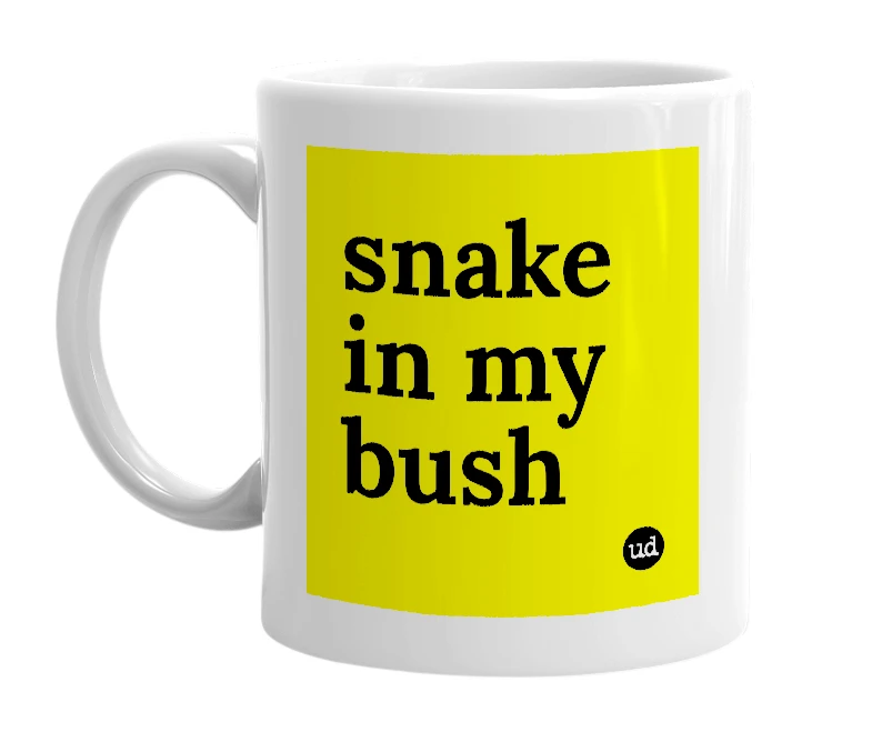 White mug with 'snake in my bush' in bold black letters