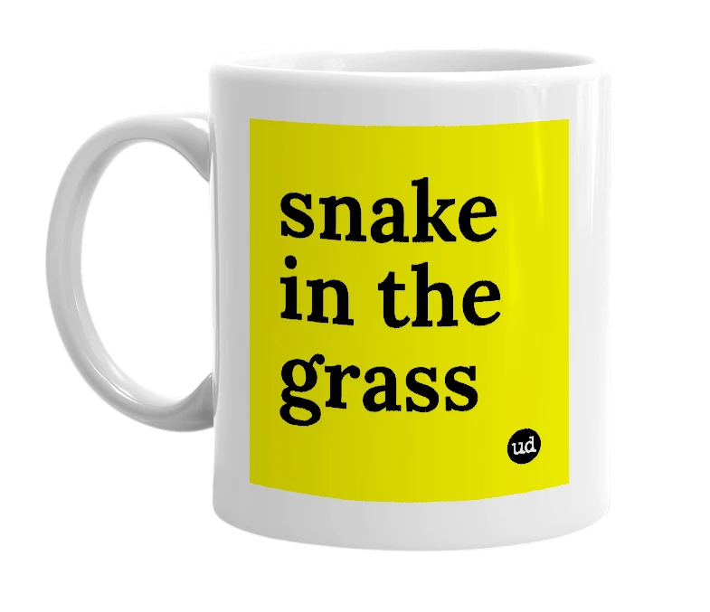 White mug with 'snake in the grass' in bold black letters