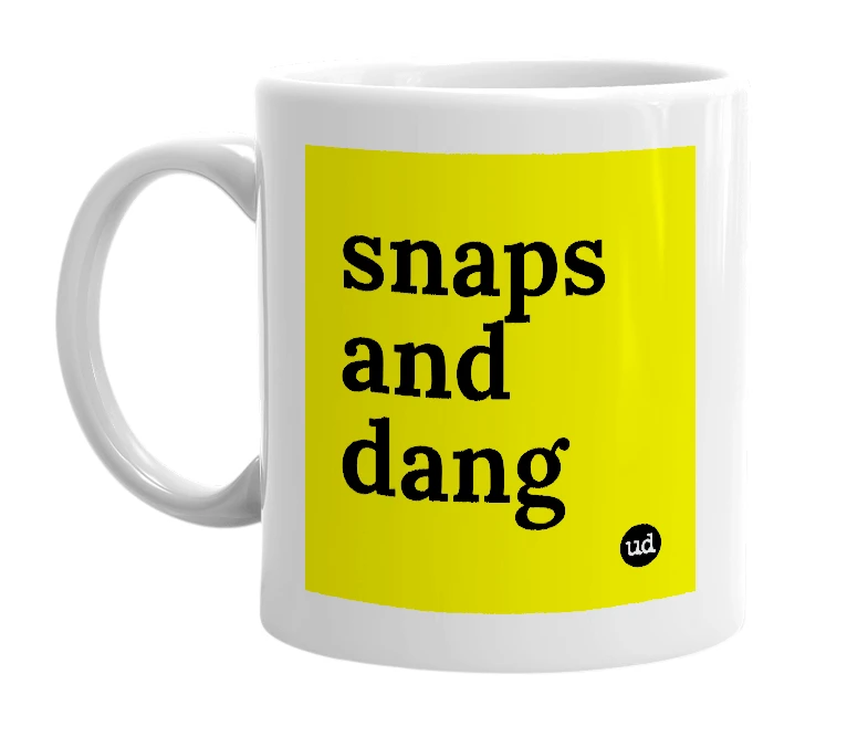 White mug with 'snaps and dang' in bold black letters