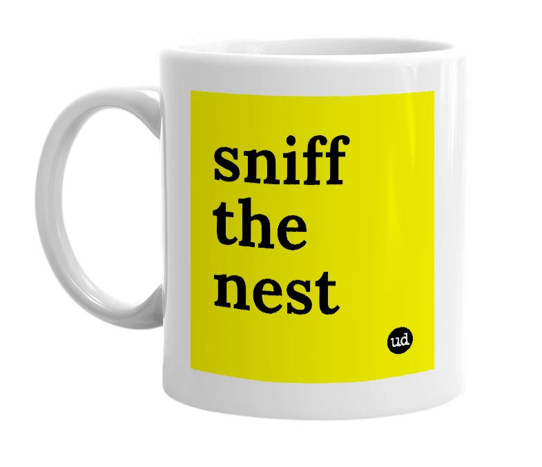 White mug with 'sniff the nest' in bold black letters