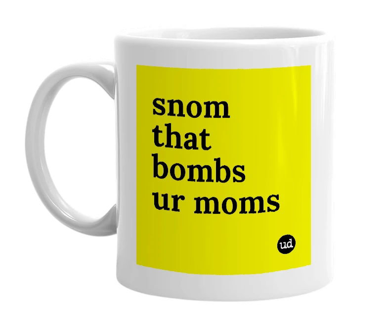 White mug with 'snom that bombs ur moms' in bold black letters
