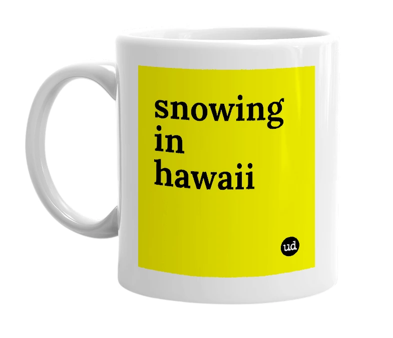 White mug with 'snowing in hawaii' in bold black letters