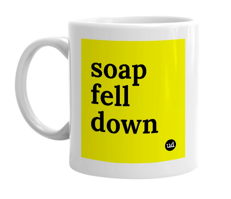 White mug with 'soap fell down' in bold black letters