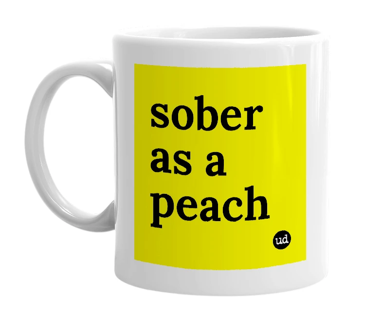 White mug with 'sober as a peach' in bold black letters