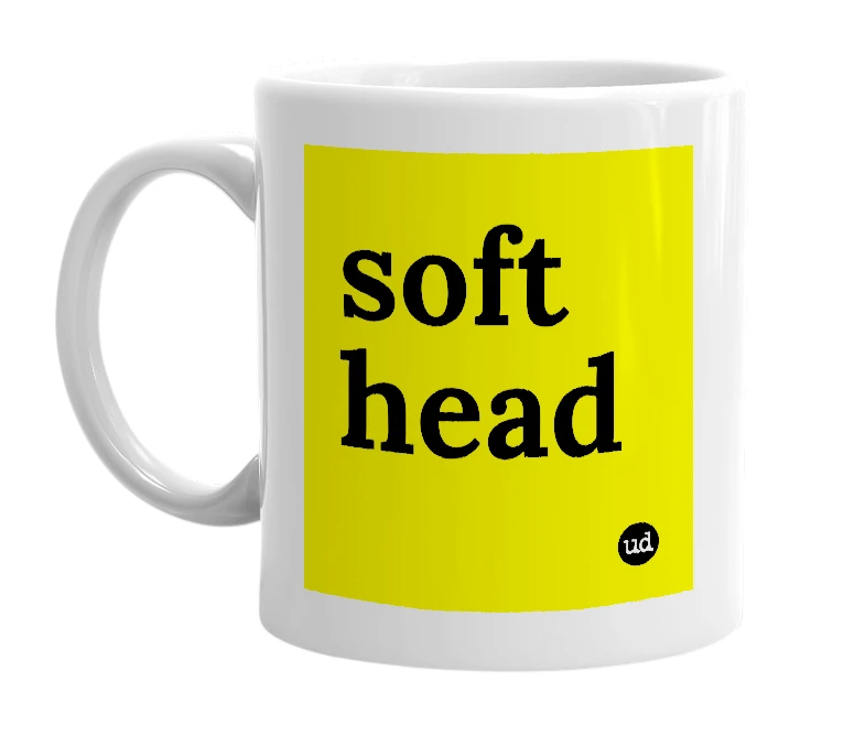 White mug with 'soft head' in bold black letters