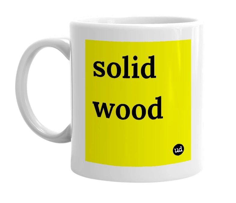 White mug with 'solid wood' in bold black letters